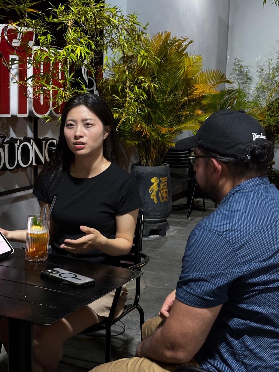 Close-up of a small conversation group during the Friday, April 10, 2026 Da Nang Language Exchange session.