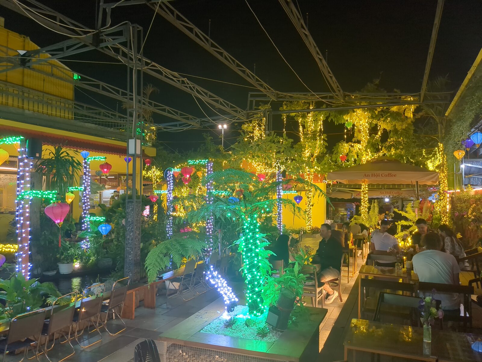 An evening waterside view across the Friday, April 3, 2026 Da Nang Language Exchange session at An Hoi Cafe.